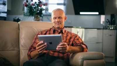 A farmer consulting MyKUHN on his tablet